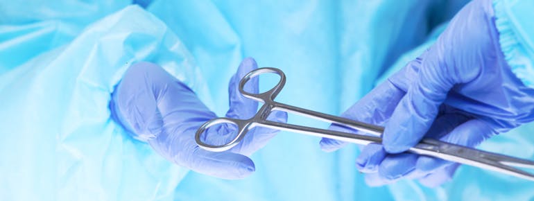 Surgeon hands at work: Friction and wear can impact a medical device&rsquo;s performance in the operating or treatment room.
