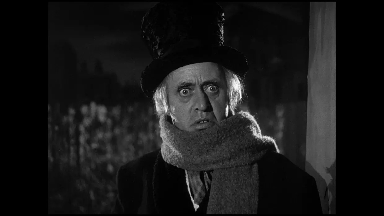 Alastair Sim as Ebenezer Scrooge