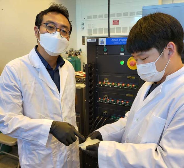 Prof. Seung Woo Lee (left) and Michael J. Lee (right) show off a more cost-effective, safer solid polymer electrolyte (rubber material) they tested for all-solid-state batteries.