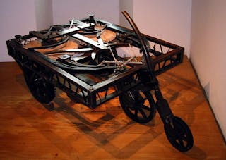 This cart, which was designed but never built by Leonardo Da Vinci in the 1600s, is powered by coiled springs and can be steered and braked. Historians concluded it was designed for use in theaters.