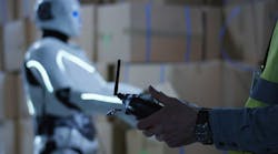 Man controlling a robot Man controlling a robot