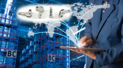 Businessman using tablet, with image of 3DEO parts superimposed