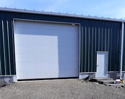 Specific requirements to upgrade a garage door system were met by automating the door with a PLC, HMI and VFD.