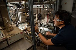 A Pacific Northwest National Laboratory scientist at Richland, Wash. helps develop a sustainable fuel component as part of research into bio-based jet fuels.