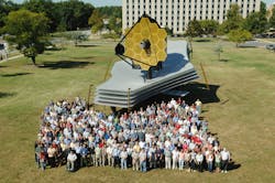 A full-scale model of the James Webb Space Telescope was assembled on the lawn at Goddard Space Flight Center. This photo gives a good indication of its size as some of the NASA personnel who designed and built it pose with it. A full-scale model of the James Webb Space Telescope was assembled on the lawn at Goddard Space Flight Center. This photo gives a good indication of its size as some of the NASA personnel who designed and built it pose with it.
