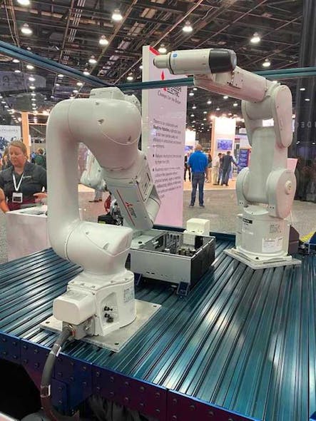 At the Mitsubishi booth, two robots (RV-7FRL and RV-8CRL) simulated their ability to move to various focal points on a workpiece, while the ASSISTA collaborative robot worked around them to inspect various points of interest.
