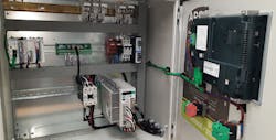 4. A control panel houses a servo control system which accurately and rapidly feeds a roll of metal plate into a die-cutting machine. The panel integrates an AutomationDirect SureServo controller with a modern CLICK PLUS PLC.