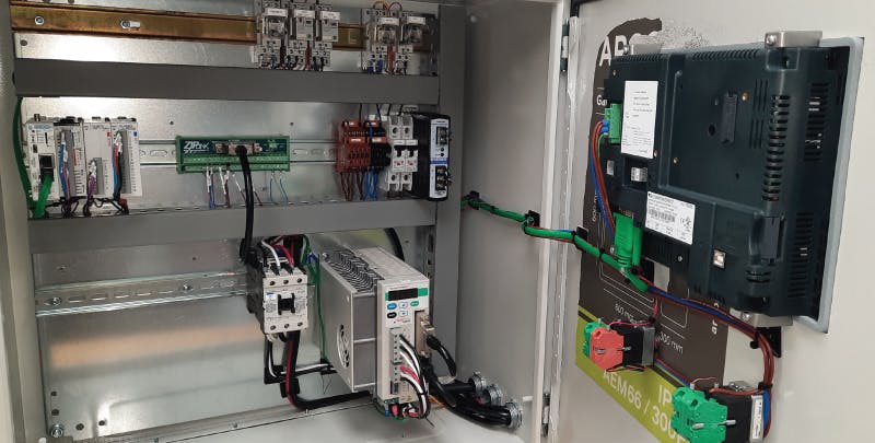 4. A control panel houses a servo control system which accurately and rapidly feeds a roll of metal plate into a die-cutting machine. The panel integrates an AutomationDirect SureServo controller with a modern CLICK PLUS PLC.