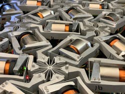 This MNN system is about the size of a microwave oven. Researchers plan to simplify the design so that thousands of the networks can be manufactured on the micro scale within 3D lattices for practical material applications. This MNN system is about the size of a microwave oven. Researchers plan to simplify the design so that thousands of the networks can be manufactured on the micro scale within 3D lattices for practical material applications.