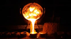 Molten metal being poured in a foundry Molten metal being poured in a foundry