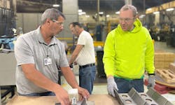 Darrell Cojocar, MMI job coach (left) and Matt Mangus, MMI employee (right). Darrell Cojocar, MMI job coach (left) and Matt Mangus, MMI employee (right).