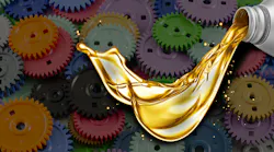 Image of pouring oil superimposed over colored gearss