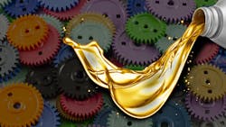 Image of pouring oil superimposed over colored gearss Image of pouring oil superimposed over colored gearss