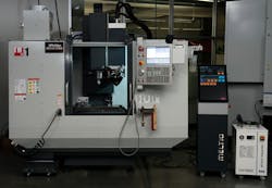 The Phillips additive hybrid system combines a Meltio wire-laser metal deposition head with a Haas TM-1 computer numerical control mill.