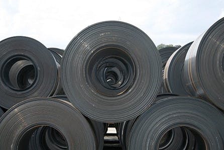 Stacks of hot rolled steel sheets.