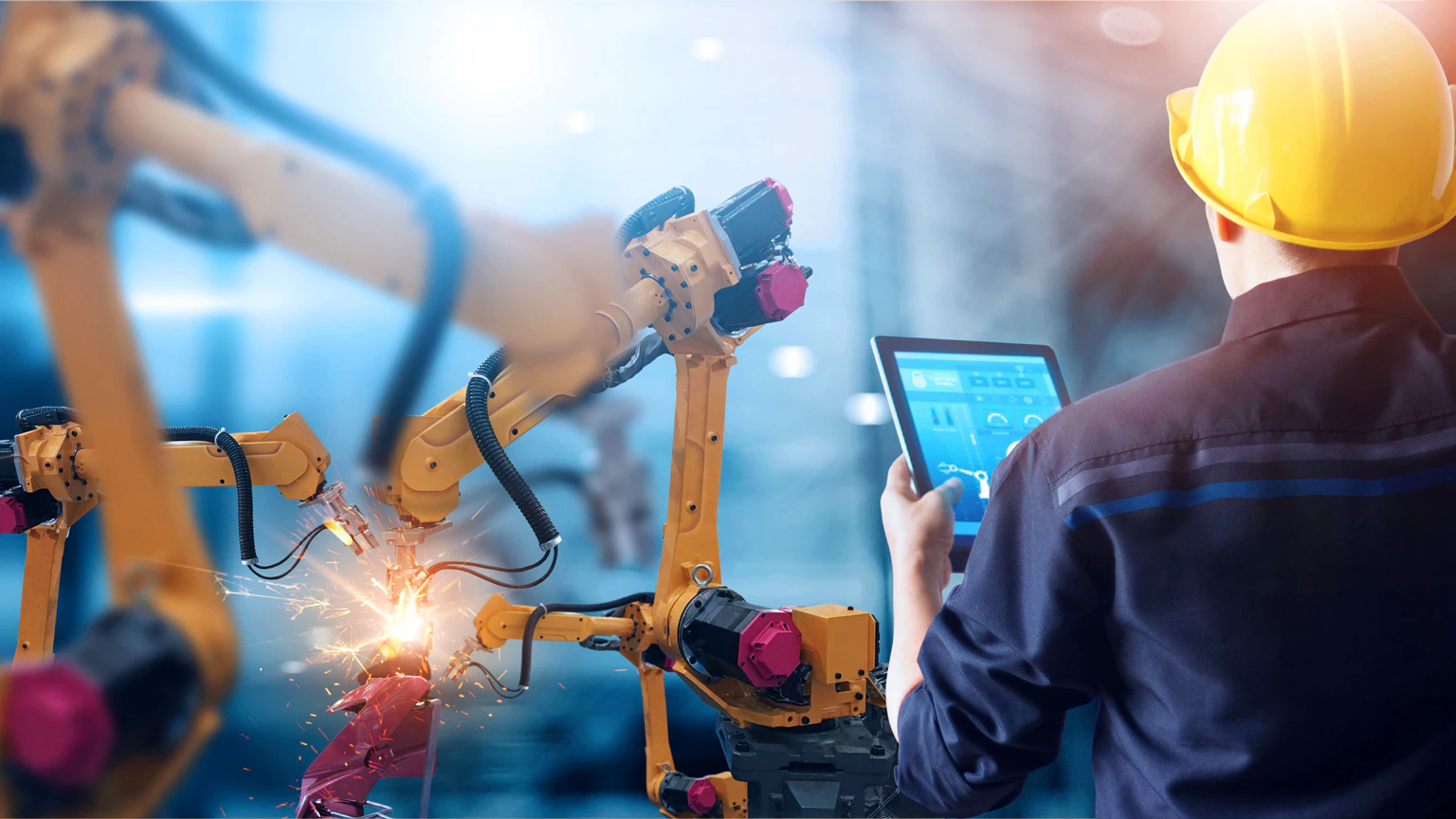 Null Engineer Engineer controls robotic arms welding