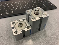 An ultra-compact Festo ADN-S cylinder, left, is considerably smaller compared to a compact ADN cylinder. An ultra-compact Festo ADN-S cylinder, left, is considerably smaller compared to a compact ADN cylinder.