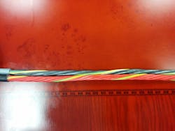 Notice how each yellow wire starts about the same spot on the right but each rotation around the cable takes a different linear distance for a full rotation. This linear distance is called the cable’s lay length and it relates to the cable’s flexibility. Notice how each yellow wire starts about the same spot on the right but each rotation around the cable takes a different linear distance for a full rotation. This linear distance is called the cable’s lay length and it relates to the cable’s flexibility.