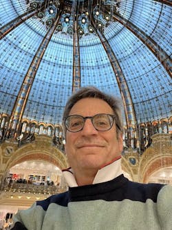 Jeff Burnstein, president of the Association for Advancing Automation, poses for a selfie at Galleries Lafayette in Paris.