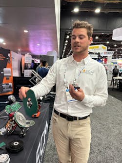 Ethan Frick, director, New Business Development, ECM PCB Stator Technology, demonstrates the features of a printed circuit board (PCB) stator motor.