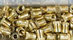 Threaded inserts close-up with mirroring in box Threaded inserts close-up with mirroring in box