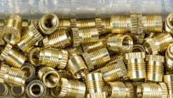 Threaded inserts close-up with mirroring in box Threaded inserts close-up with mirroring in box