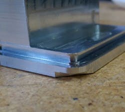 This part has an undercut feature that cannot be reached in the machining process. This part has an undercut feature that cannot be reached in the machining process.