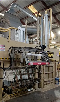 1. A cotton press with bale nearly bundled. Compressing the 480-lb bales requires significant tonnage and complex controls to ensure the machine output is consistent. 1. A cotton press with bale nearly bundled. Compressing the 480-lb bales requires significant tonnage and complex controls to ensure the machine output is consistent.