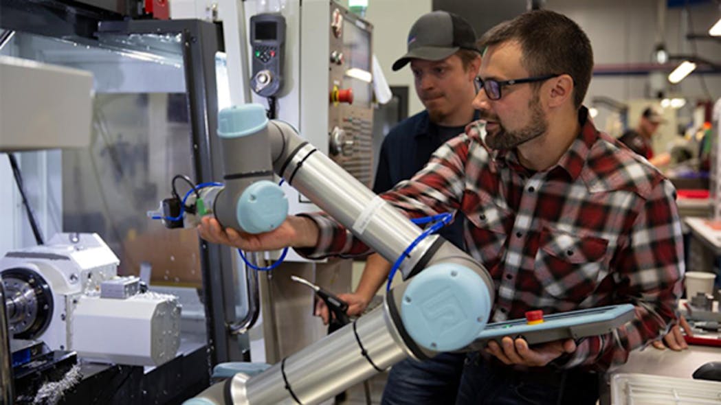 Programming a cobot for a machine-tending application.