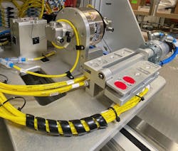 The aluminum housing of the industrial electronic component is mounted on a machine prior to assembly. A round opening is pointing up ready for the insertion of a plastic cover. The aluminum housing of the industrial electronic component is mounted on a machine prior to assembly. A round opening is pointing up ready for the insertion of a plastic cover.