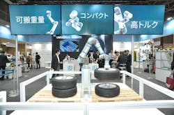 Universal Robots unveiled the UR30 at iREX in Japan. Here it demonstrates the UR30’s heavy payload capabilities by lifting a tire and a rim together. Universal Robots unveiled the UR30 at iREX in Japan. Here it demonstrates the UR30’s heavy payload capabilities by lifting a tire and a rim together.