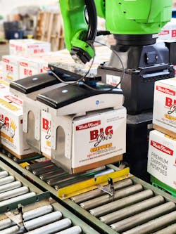 Two OnRobot 2FPG20 electric finger grippers are mounted side-by-side, customized with curved fingers on one side to tuck under one side of the box with 40 nanometers of force, compress the box, and lift it. Two OnRobot 2FPG20 electric finger grippers are mounted side-by-side, customized with curved fingers on one side to tuck under one side of the box with 40 nanometers of force, compress the box, and lift it.