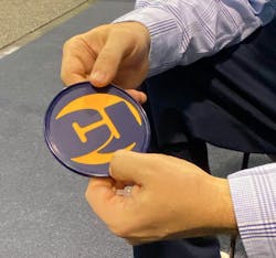 C&J Industries showcased its two-shot molding process at the recent IME West Show in Anaheim. The press has two barrels, and for this demo part, the dark blue rigid resin is molded first then rotates 180 deg. and finishes with the softer yellow resin while the blue is starting the next part. C&J Industries showcased its two-shot molding process at the recent IME West Show in Anaheim. The press has two barrels, and for this demo part, the dark blue rigid resin is molded first then rotates 180 deg. and finishes with the softer yellow resin while the blue is starting the next part.