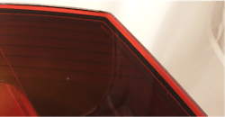 Close-ups of laser weld of automotive rear lamp through red lens. Close-ups of laser weld of automotive rear lamp through red lens.