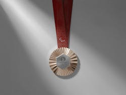 The back of the Paralympic medals features a graphic representation of the Eiffel Tower viewed from below. The words “Paris” and “2024” at the base of the tower are inscribed in universal Braille, the symbolic language of accessibility and honoring French inventor, Louis Braille. The back of the Paralympic medals features a graphic representation of the Eiffel Tower viewed from below. The words “Paris” and “2024” at the base of the tower are inscribed in universal Braille, the symbolic language of accessibility and honoring French inventor, Louis Braille.