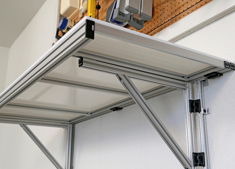 Figure 1. This DIY shelf features a 1̎ × 3 in. grooved extrusion with black endcaps and hinges. Image courtesy of 80/20.