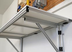 Figure 1. This DIY shelf features a 1̎ × 3 in. grooved extrusion with black endcaps and hinges. Image courtesy of 80/20. Figure 1. This DIY shelf features a 1̎ × 3 in. grooved extrusion with black endcaps and hinges. Image courtesy of 80/20.