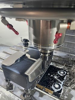 The entire putter assembly on a CNC milling machine. The entire putter assembly on a CNC milling machine.