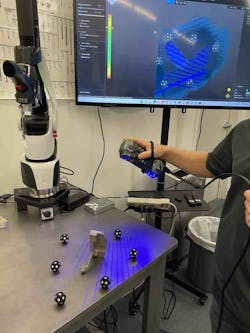 A CCCS team member uses a handheld 3D scanner to capture the 3D data of a part. A CCCS team member uses a handheld 3D scanner to capture the 3D data of a part.