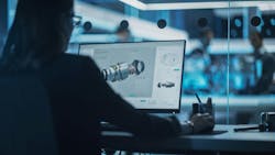 Industrial engineer working on CAD software Industrial engineer working on CAD software