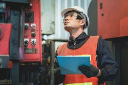 Engineer inspecting equipment Engineer inspecting equipment