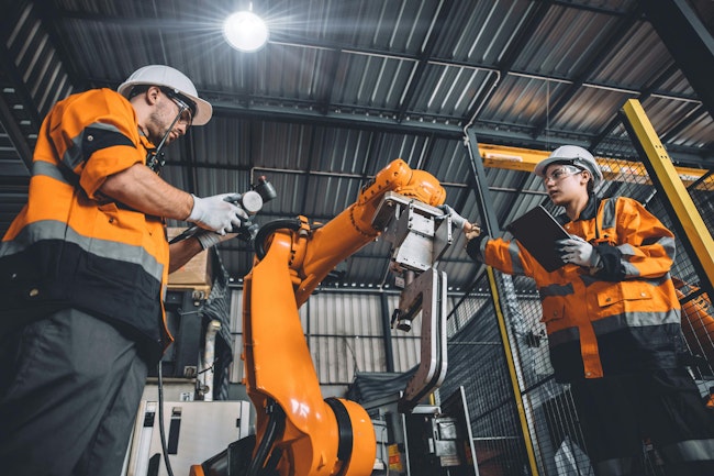 Engineer team services a welding robot