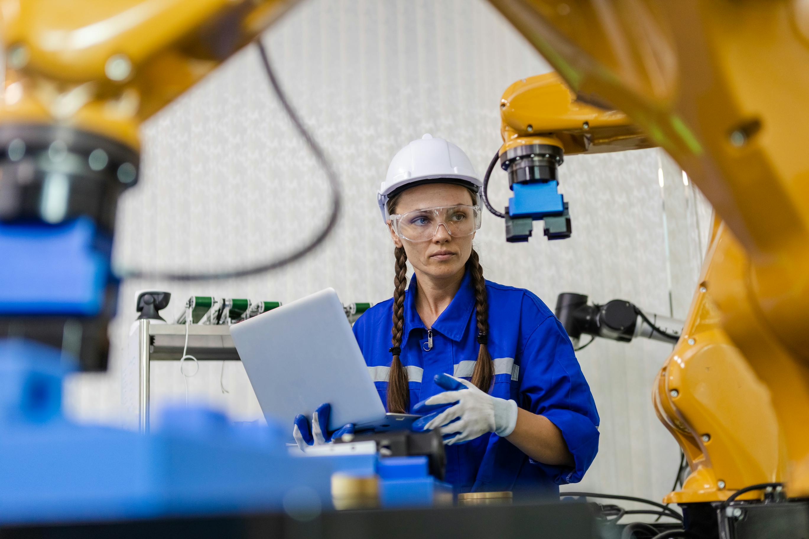 Female engineer checking robotics