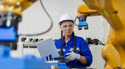Female engineer checking robotics Female engineer checking robotics