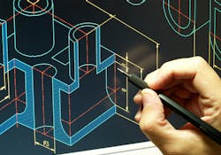 Engineer working on CAD blueprint Engineer working on CAD blueprint