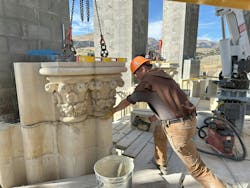 Carmelite monks combine precision-machining with traditional craftmanship to ensure structural integrity. Here, a monk manually places stone parts. Carmelite monks combine precision-machining with traditional craftmanship to ensure structural integrity. Here, a monk manually places stone parts.