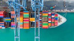 Aerial top view of a crane and shipping container Aerial top view of a crane and shipping container