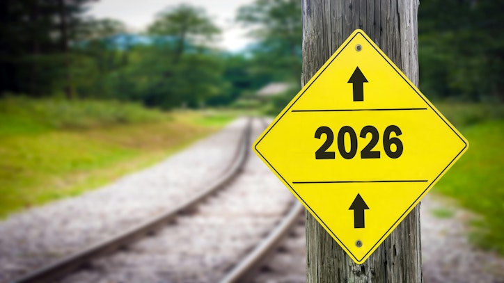 Signpost pointing in the direction of the year 2026.
