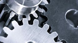 Industrial metal gears and machine parts connected Industrial metal gears and machine parts connected