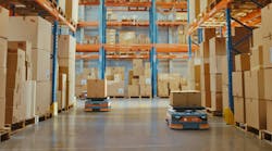 AGV Robots transporting cardboard Boxes in distribution logistics center. AGV Robots transporting cardboard Boxes in distribution logistics center.